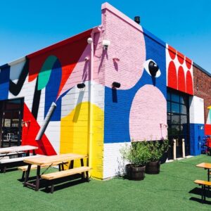 Night Shift patio in Everett featuring colorful walls and picnic tables